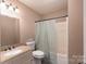 Bathroom features a shower-tub combo, granite vanity, and a modern sink at 500 Belleview Rd, Rock Hill, SC 29730