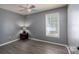 Bedroom with a window, ceiling fan, and wood-look vinyl flooring at 500 Belleview Rd, Rock Hill, SC 29730