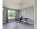 Office/bedroom with sleek ceiling fan, wood-look floors, and large windows at 500 Belleview Rd, Rock Hill, SC 29730