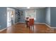 Cozy dining area features hardwood floors, modern colors, and a lovely round table with seating for two at 500 Belleview Rd, Rock Hill, SC 29730