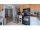 Kitchen features stainless steel refrigerator, black oven and microwave, and adjacent breakfast area at 500 Belleview Rd, Rock Hill, SC 29730