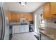 Traditional kitchen features tiled floors, light-colored countertops and cabinets, and a stainless-steel refrigerator at 500 Belleview Rd, Rock Hill, SC 29730