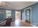 Living room boasts neutral gray walls, hardwood floors, and a view of the front porch at 500 Belleview Rd, Rock Hill, SC 29730