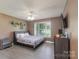 Spacious primary bedroom featuring a ceiling fan, natural light, and wood-look flooring at 500 Belleview Rd, Rock Hill, SC 29730