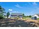 Picture of a spacious backyard featuring a shed, trees, and a small patio area for relaxation at 5016 Old Pine Ln, Cherryville, NC 28021