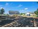 Backyard with a shed, fire pit, landscaping, trees, and a grassy area, offering space for recreation and relaxation at 5016 Old Pine Ln, Cherryville, NC 28021