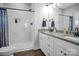 Modern bathroom featuring double granite vanity and walk-in shower with elegant marble tile at 5016 Old Pine Ln, Cherryville, NC 28021
