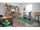 Bright bedroom featuring a desk, bookshelves, and wood flooring at 5016 Old Pine Ln, Cherryville, NC 28021