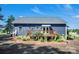 Rear exterior of the house with a porch, stairs, and landscaping at 5016 Old Pine Ln, Cherryville, NC 28021