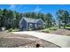 This charming home boasts a long driveway, lush landscaping, and beautiful curb appeal in a tranquil, wooded setting at 5016 Old Pine Ln, Cherryville, NC 28021