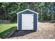 Exterior shot of a well-maintained shed, highlighting its ample storage space and clean design at 5016 Old Pine Ln, Cherryville, NC 28021
