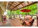 Relaxing back deck with seating and a grill at 504 Amon Ln, Pineville, NC 28134