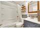 Updated bathroom featuring stylish vanity and shower-tub combo at 504 Amon Ln, Pineville, NC 28134