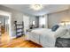 Cozy bedroom with hardwood floors, a writing desk, and comfortable bed at 504 Amon Ln, Pineville, NC 28134
