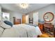 Bedroom with hardwood floors, a writing desk and bright natural light at 504 Amon Ln, Pineville, NC 28134