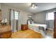 Neutral bedroom with hardwood floors, light, and comfortable bed at 504 Amon Ln, Pineville, NC 28134