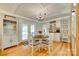 Bright dining room with decorative ceiling, chandelier, and built-in cabinet at 504 Amon Ln, Pineville, NC 28134