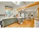 Spacious kitchen with wood beams, stainless steel appliances, and hardwood floors at 504 Amon Ln, Pineville, NC 28134
