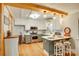 Cozy kitchen with white cabinets, stainless steel appliances, and breakfast bar at 504 Amon Ln, Pineville, NC 28134