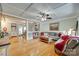 Open-concept living room with hardwood floors connecting to dining area at 504 Amon Ln, Pineville, NC 28134