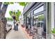 Charming street view of a store front, The Brass Bird, with outdoor seating and inviting curb appeal at 504 Amon Ln, Pineville, NC 28134