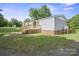An outdoor view of the home's wooden deck and backyard at 6085 Faith Rd, Salisbury, NC 28146