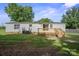 The backyard features an elevated, wooden deck, perfect for outdoor entertaining at 6085 Faith Rd, Salisbury, NC 28146