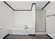 Clean bathroom featuring a soaking tub and glass-enclosed shower at 6085 Faith Rd, Salisbury, NC 28146