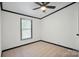 Bedroom with neutral carpet, ceiling fan, and natural light from the window at 6085 Faith Rd, Salisbury, NC 28146