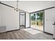 Dining area featuring modern flooring and access to the outdoor wooden deck at 6085 Faith Rd, Salisbury, NC 28146