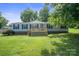 Charming single-story home with a wooden deck and well-maintained lawn at 6085 Faith Rd, Salisbury, NC 28146