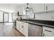 Bright kitchen featuring stainless steel appliances, granite countertops, and white cabinetry at 6085 Faith Rd, Salisbury, NC 28146