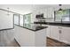 Modern kitchen featuring a center island, granite countertops, and stainless steel appliances at 6085 Faith Rd, Salisbury, NC 28146