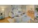 Bright living room with modern decor, hardwood floors, and a view of the adjacent dining area at 6116 Springhouse Ln, Charlotte, NC 28211