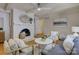Comfortable living room featuring a white brick fireplace, hardwood floors, a ceiling fan and a seating area at 6116 Springhouse Ln, Charlotte, NC 28211