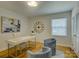 Comfortable office space with large window, refinished hardwood floors, and stylish decor at 6116 Springhouse Ln, Charlotte, NC 28211