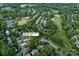 An aerial view of the property and surrounding neighborhood in Charlotte, North Carolina; including a golf course nearby at 6400 Morningsong Ln, Charlotte, NC 28269