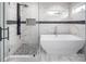 Modern bathroom highlighting a glass shower and freestanding tub, offering a spa-like experience at 6400 Morningsong Ln, Charlotte, NC 28269