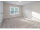 Comfortable bedroom with ample natural light, perfect for relaxation and rest at 6400 Morningsong Ln, Charlotte, NC 28269