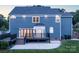 Stunning backyard view with large deck, patio, and beautifully landscaped yard at 6400 Morningsong Ln, Charlotte, NC 28269