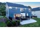 Beautiful backyard view with large deck, patio, and well-maintained lawn at 6400 Morningsong Ln, Charlotte, NC 28269
