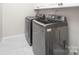 Modern laundry room with a washer and dryer at 6400 Morningsong Ln, Charlotte, NC 28269