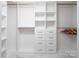 Bright walk-in closet features custom shelving and drawers, maximizing storage space at 6400 Morningsong Ln, Charlotte, NC 28269