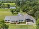 Sprawling property with a house, pond, car port, and lush green fields and trees at 714 Helms Efird Rd, Marshville, NC 28103