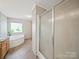 Bathroom featuring soaking tub and glass shower at 714 Helms Efird Rd, Marshville, NC 28103