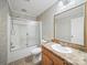 Bathroom featuring a shower with glass doors, toilet, and a vanity with a large mirror at 714 Helms Efird Rd, Marshville, NC 28103