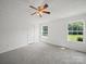 Bedroom with gray carpet, white walls, and two windows providing natural light at 714 Helms Efird Rd, Marshville, NC 28103
