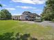 Spacious metal carport provides covered parking for vehicles or recreational equipment with ample gravel space at 714 Helms Efird Rd, Marshville, NC 28103