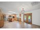 Open concept kitchen boasts stainless steel appliances, a center island, and access to an outdoor area at 714 Helms Efird Rd, Marshville, NC 28103