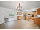 Open kitchen layout featuring stainless steel appliances, center island, and a view into another room at 714 Helms Efird Rd, Marshville, NC 28103